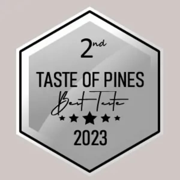 Silver hexagonal award for "2nd Taste of Pines Best Taste 2023" with five stars.